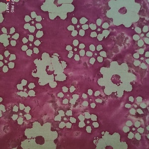 May include: Purple fabric with a green floral pattern. The fabric is measured with a ruler that reads "1359 St. Louis".