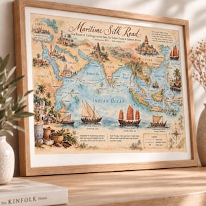 May include: A framed map titled Maritime Silk Road, depicting historical sea trade routes across Asia, the Indian Ocean, and Eastern Africa. The map features watercolour illustrations of ships, coastal cities, and a compass rose on a parchment-style background with text detailing the routes from the 2nd century BCE to the 15th century CE.