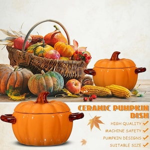May include: An orange ceramic pumpkin dish with a lid and dark brown handles. The text reads: CERAMIC PUMPKIN DISH, HIGH QUALITY, MACHINE SAFETY, PUMPKIN DESIGNS, SUITABLE SIZE. A wicker basket filled with various pumpkins, apples, and corn sits nearby.