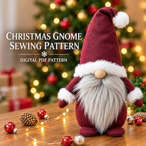 May include: A plush gnome with a tall burgundy felt hat, a white faux fur trim, a long gray faux fur beard, and a round wooden nose. The text CHRISTMAS GNOME SEWING PATTERN and DIGITAL PDF PATTERN is displayed in white lettering.