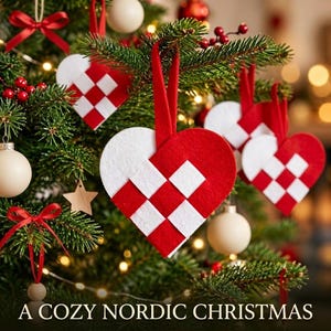 May include: A set of woven heart-shaped ornaments made from red and white felt strips, each featuring a matching red felt hanging loop. These decorative pieces are displayed hanging from the green branches of a Christmas tree.