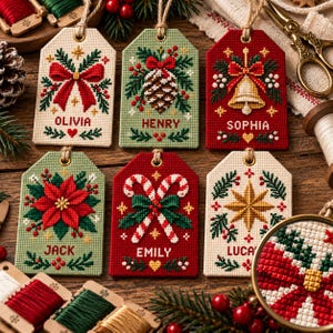 May include: Six rectangular cross-stitch ornaments with jute twine loops. Designs include a red bow, pinecone, bell, poinsettia, candy canes, and star. Each features a name: Olivia, Henry, Sophia, Jack, Emily, or Luca, with festive greenery and berries.