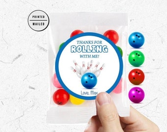 May include: A blue and white round sticker with the text "Thanks for Rolling with me!" and a bowling ball and pins graphic. The sticker is on a clear plastic bag filled with colorful candy. The text "Love, Max" is at the bottom of the sticker.
