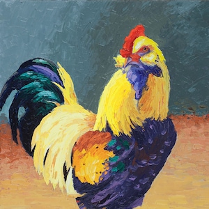 May include: A colorful rooster with a red comb and wattle, yellow feathers, and a purple, green, and black tail. The rooster is standing on a light brown surface.