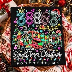 May include: A black t-shirt featuring a neon-style graphic of a small town Christmas scene with the number 38863, a red truck, a gingerbread man, Santa in a sleigh, and the text Small Town Christmas PONTOTOC, MS in white script lettering.