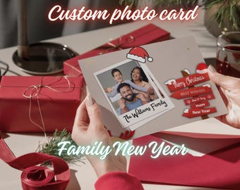 May include: A rectangular custom photo card featuring a central Polaroid-style image of a family with the text The Williams Family. To the right, a red wooden signpost graphic displays Merry Christmas, Best Wishes, and Happy New Year.
