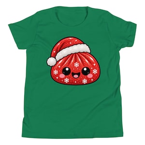 May include: A green short-sleeved t-shirt featuring a graphic of a red, glittery, round dumpling character wearing a white-trimmed Santa hat. The dumpling has a smiling face with large black eyes, pink cheeks, and white snowflake accents.