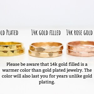 May include: Three gold rings, one gold plated, one 14k gold filled, and one 14k rose gold filled. The rings are stacked on top of each other and have a hammered texture. "Please be aware that 14k gold filled is a warmer color than gold plated jewelry. The color will also last you for years unlike gold plating."