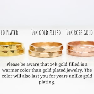 May include: Three gold rings, one gold plated, one 14k gold filled, and one 14k rose gold filled. The rings are stacked on top of each other and have a hammered texture. "Please be aware that 14k gold filled is a warmer colour than gold plated jewellery. The colour will also last you for years unlike gold plating."