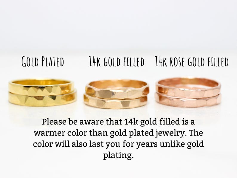 May include: Three gold rings, one gold plated, one 14k gold filled, and one 14k rose gold filled. The rings are stacked on top of each other and have a hammered texture. "Please be aware that 14k gold filled is a warmer colour than gold plated jewellery. The colour will also last you for years unlike gold plating."