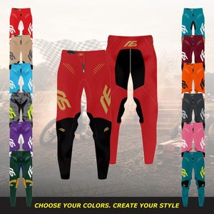 May include: A collection of motocross pants in various colorways, featuring a central red pair with black lower legs and gold branding. Each pair includes a zippered front closure, reinforced seat panels, and the text "16" printed on the thighs.