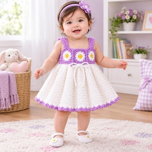 May include: A handmade crochet dress featuring a white skirt with a purple scalloped hem and a purple bodice adorned with three white and yellow daisy motifs. The dress includes a white drawstring tie at the waist and a matching purple headband.