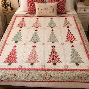 May include: A quilt featuring a repeating pattern of twelve Christmas trees in shades of red, pink, and light blue, each topped with a red star. The quilt has a cream-colored background with a floral border and is displayed on a bed.