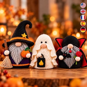 May include: Three crocheted figures: a witch gnome with a black hat, broom, and pumpkin; a ghost gnome holding a black lantern; and a vampire gnome with a black cape, red lining, bat, and red rose. All have gray beards and round noses.