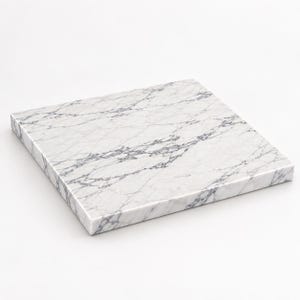 May include: A square slab of white marble featuring prominent grey veining throughout the surface. The stone board has a smooth, polished finish and straight, clean edges, presenting a uniform thickness across its entire flat, rectangular form.