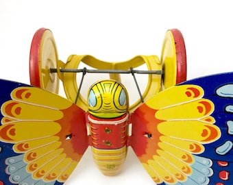 Vintage // Metal Lithographed Butterfly Push Toy on Wheels
