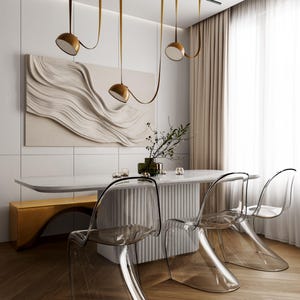 May include: A dining set featuring a white marble-topped table with a fluted base, three transparent acrylic chairs, and a gold bench. Above the table hangs a black linear pendant light fixture with three gold dome shades suspended by straps.