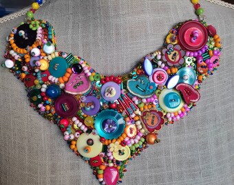 Multicolored bib necklace made with 4 hands