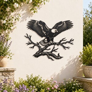 May include: A black metal wall art piece featuring a bald eagle with wings spread wide, perched atop a detailed, leafless tree branch. The silhouette design showcases the eagle's feathers and the intricate, jagged texture of the wooden branch.