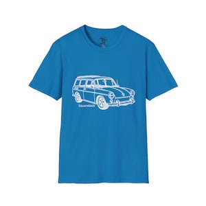 May include: A bright blue short-sleeved t-shirt featuring a white line art illustration of a classic station wagon car on the front. Below the vehicle graphic, the word Squareback is printed in white text. The shirt has a round crew neckline.