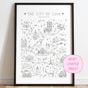 May include: A black and white framed poster titled THE CITY OF LOVE featuring a hand-drawn map illustration with various landmarks, buildings, trees, and figures connected by a winding path, including text labels for life events and locations.