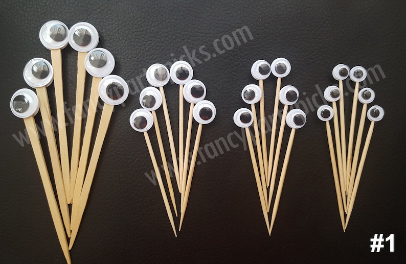 May include: Assortment of googly eyes on wooden skewers. The eyes are various sizes and come in white with black pupils. There are 18 googly eyes in total.