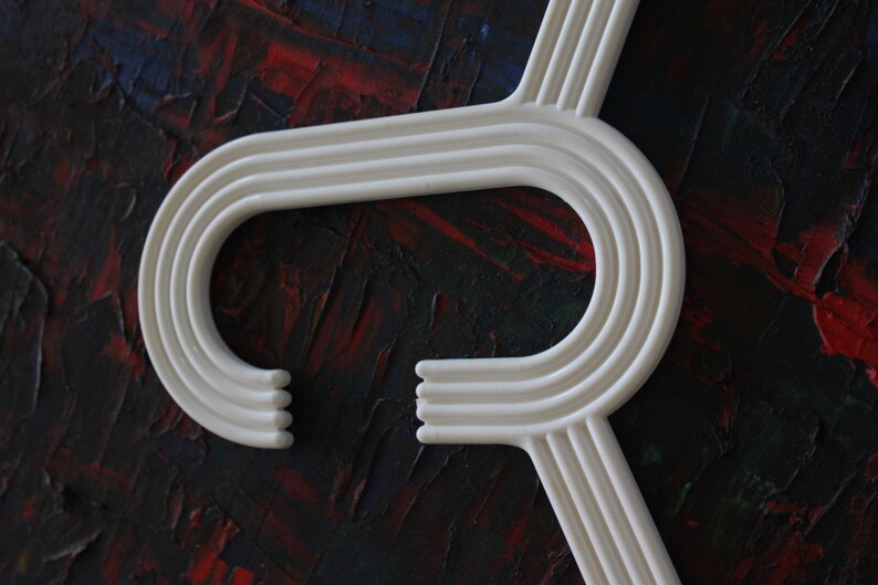 made by Karhumuovi Finland Truly and sincerely retro and cool designer white plastic hanger set of 4