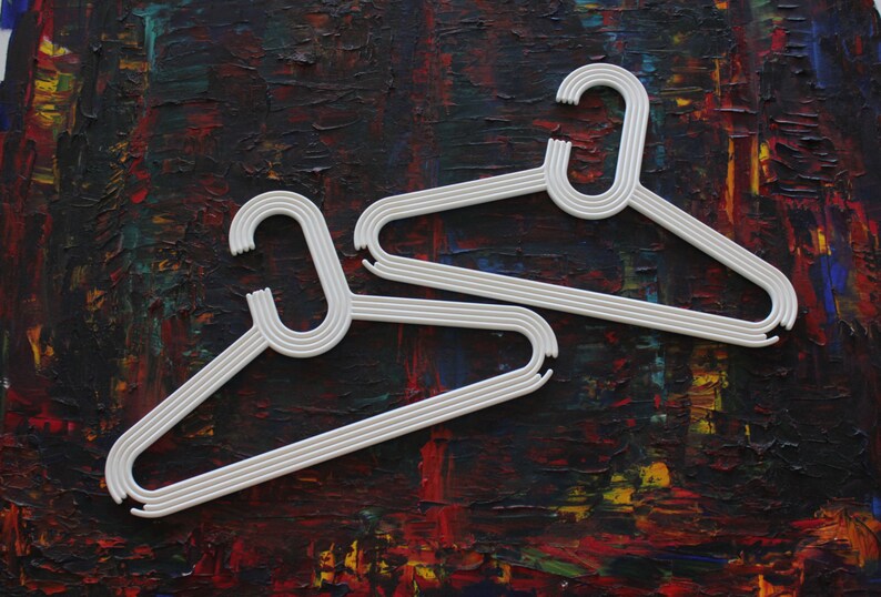 made by Karhumuovi Finland Truly and sincerely retro and cool designer white plastic hanger set of 4