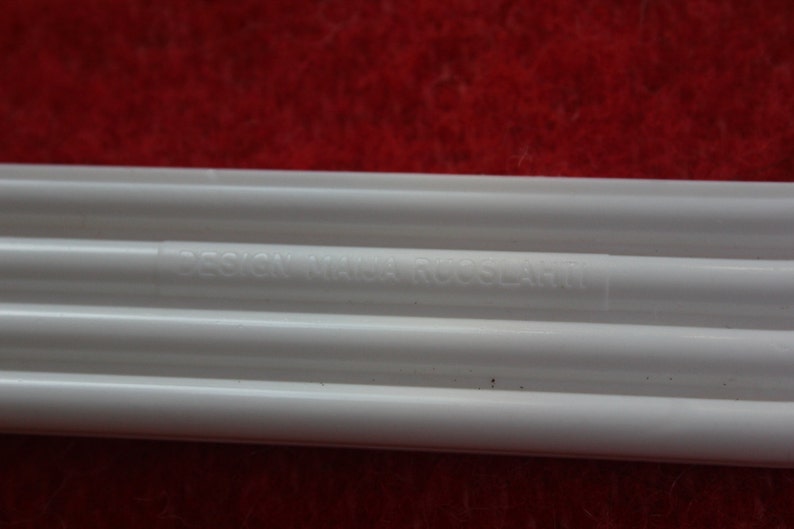 made by Karhumuovi Finland Truly and sincerely retro and cool designer white plastic hanger set of 4