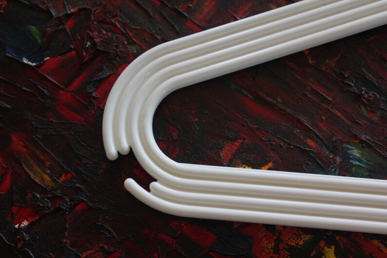 made by Karhumuovi Finland Truly and sincerely retro and cool designer white plastic hanger set of 4