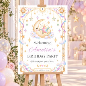 May include: A rectangular birthday party welcome sign featuring a gold arched frame, a crescent moon with a face, a rainbow star, and pastel clouds. The text reads: Welcome to Amelia's BIRTHDAY PARTY. We're so glad you're here! THE BIRTHDAY STAR.