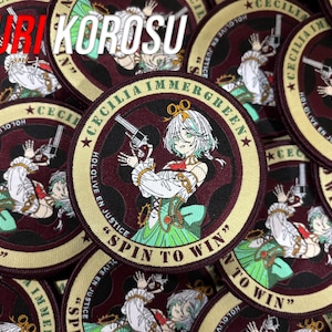 May include: A circular embroidered patch featuring an anime-style character with white hair holding a revolver. The design includes the text CECILIA IMMERGREEN, HOLOLIVE EN JUSTICE, and SPIN TO WIN in a dark red and cream color scheme with green accents.