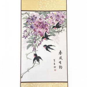 May include: A vertical wall scroll featuring a painting of purple wisteria flowers and four black swallows with pink throats. The artwork includes black Chinese calligraphy characters and a red seal. The scroll has gold patterned borders.
