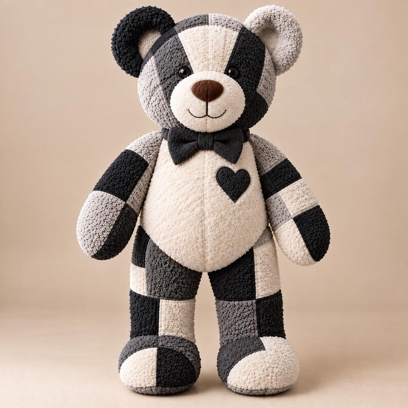 Memory bear sewing pattern example showing a finished black and cream patchwork teddy bear with bow tie and heart detail