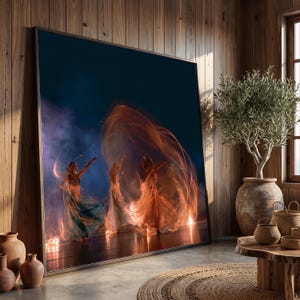 May include: A large framed wall art print depicting three figures in motion against a dark background. The figures are surrounded by swirling orange light trails and blue smoke, creating a dynamic effect. The artwork is displayed in a room.