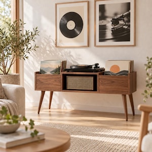 May include: A mid-century modern walnut wood media console featuring tapered legs, two side storage compartments for vinyl records, and a central open shelf housing a black turntable and a rectangular speaker with a textured mesh front.