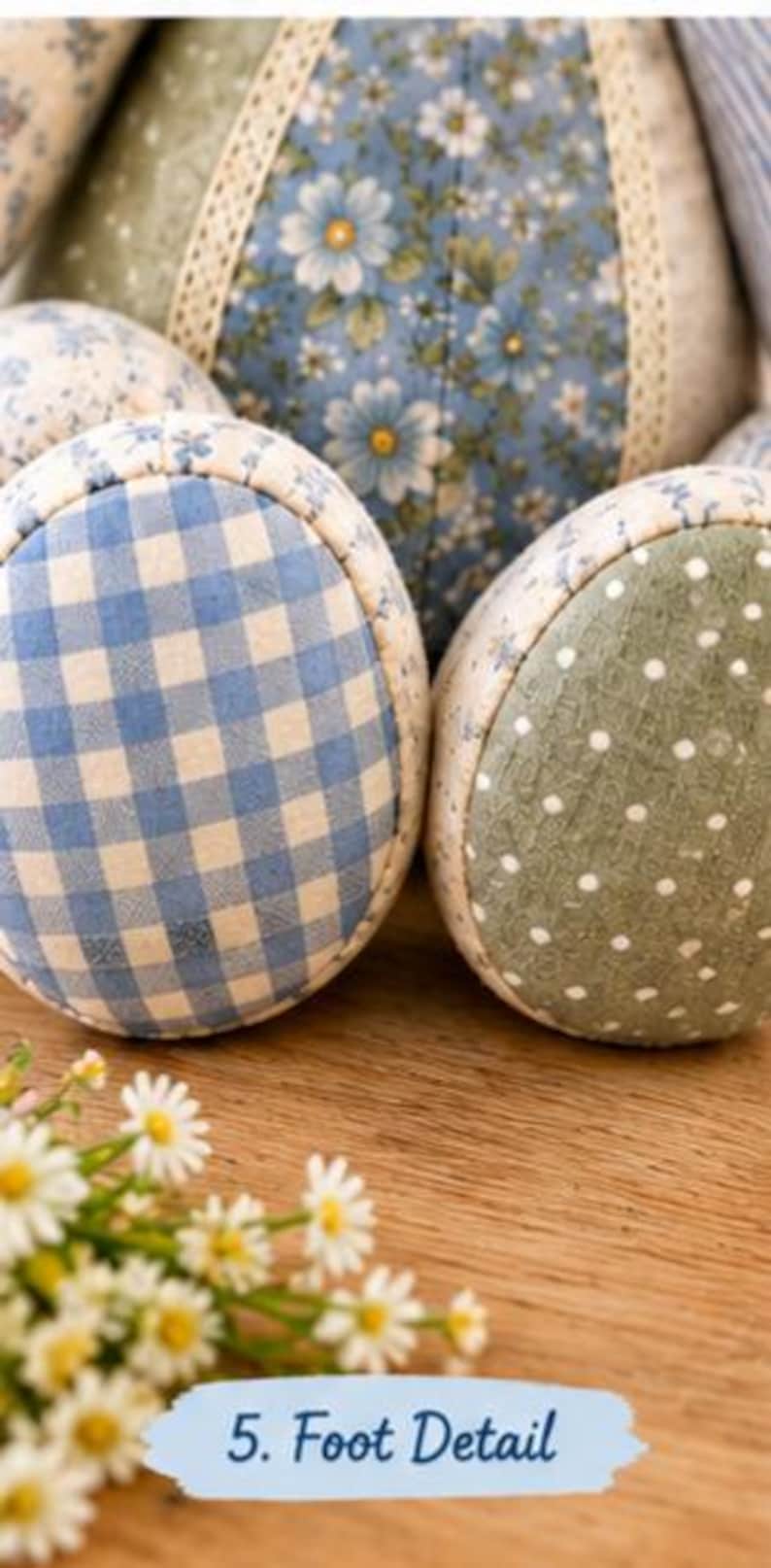 May include: A stuffed fabric animal featuring two round feet with distinct patterns. One foot displays a blue and white gingham check, while the other features a sage green fabric with white polka dots. The text 5. Foot Detail is visible.