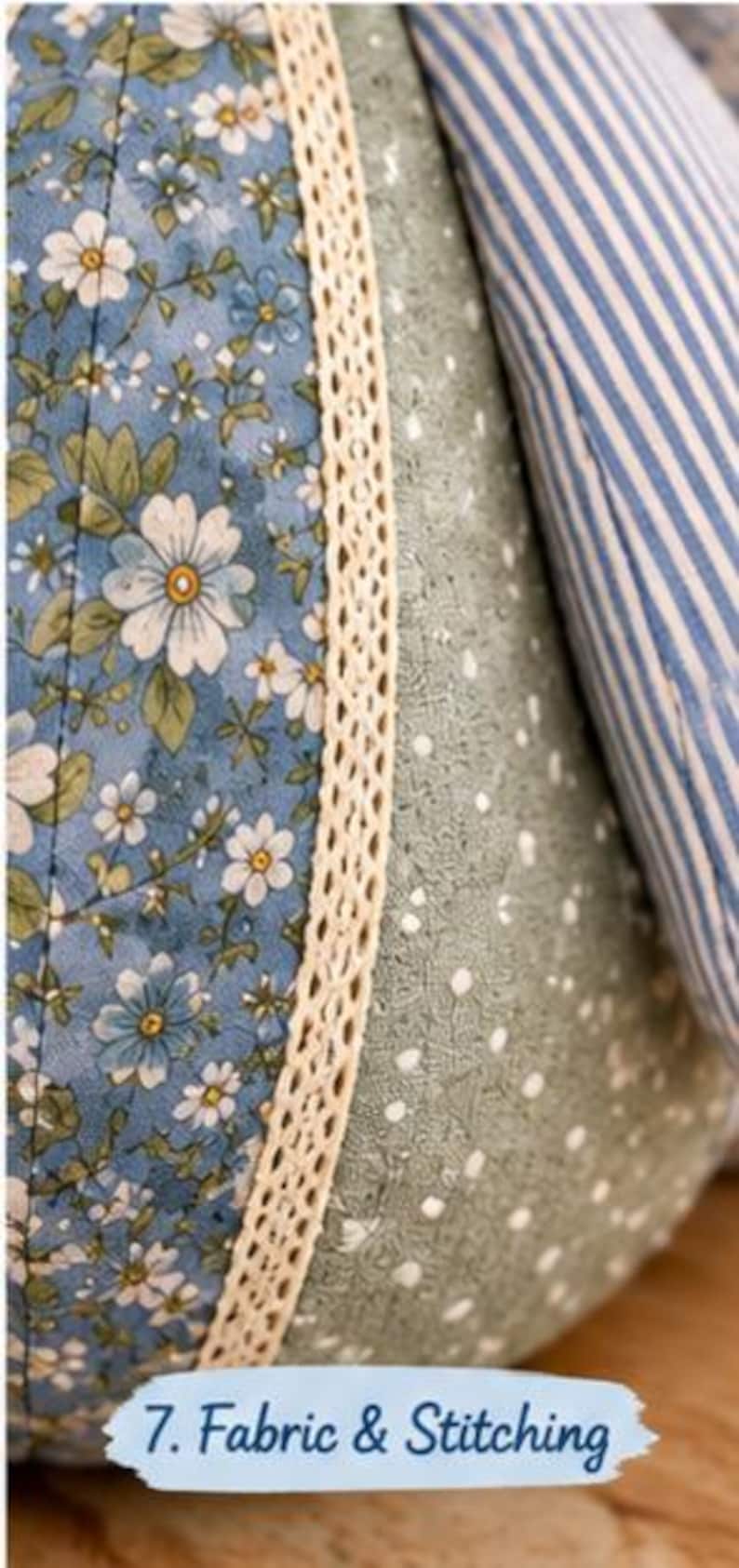 May include: A quilted fabric object featuring panels of blue floral print, sage green fabric with white dots, and blue and white stripes. A cream-coloured lace trim separates the panels. The text 7. Fabric & Stitching is printed at the bottom.