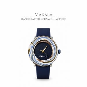 May include: A wristwatch with a dark blue strap and a round ceramic face featuring a swirling blue, white, and brown marbled pattern. The dark blue dial displays gold-toned hands and the text MAKALA. Above the watch, the text reads MAKALA HANDCRAFTED CERAMIC TIMEPIECE.