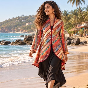 May include: A long-sleeved jacket featuring a vibrant, multi-colored patchwork pattern with diagonal stripes in shades of red, orange, yellow, and blue. The jacket has a high collar, a front button closure, and a solid black dress worn underneath.