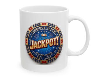 May include: A white ceramic mug featuring a circular graphic with a blue background, gold crown, and fireworks. The text reads GOWANUS GAMING, JACKPOT!, GRAND PRIZE, and EST. 2023, surrounded by a red, white, and blue border with star accents.