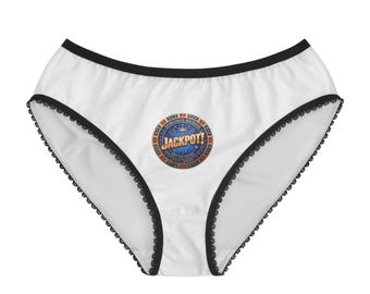 May include: White underwear featuring a black waistband and black lace trim along the leg openings. The centre displays a circular graphic with a blue background, gold text reading JACKPOT!, and the words GOWANUS GAMING EST. 2023.