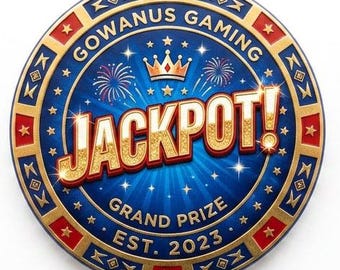 May include: A circular token featuring a blue background with gold fireworks and a crown. The text reads GOWANUS GAMING, JACKPOT!, GRAND PRIZE, and EST. 2023. The border is decorated with alternating red and gold segments containing small star icons.