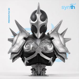 May include: A detailed 3D bust of a warrior figure wearing a black and silver helmet with a central crest. The armour features silver shoulder pauldrons with spikes, intricate chest plate detailing, and a base with ornate carvings. Text reads synth.