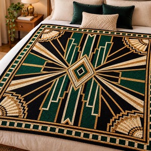 May include: A rectangular crochet blanket featuring a geometric pattern in black, forest green, and cream. The design includes a central diamond, radiating sunburst lines, and fan-shaped corner motifs, all bordered by a repeating square pattern.