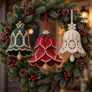May include: Three crocheted bell ornaments hanging from a green pine wreath. The left bell is dark green with gold trim, the center bell is red with layered leaf-like petals and gold edges, and the right bell is cream with intricate snowflake patterns.