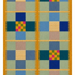 May include: A rectangular area rug featuring a grid pattern of sage green squares interspersed with blocks of royal blue, light blue, and tan. The design includes accent squares with small multicoloured checkerboard or horizontal stripe patterns.