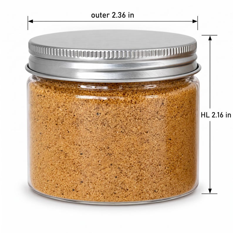 Closed clear jar of warm golden beige colored quartz sand with a silver metal screw lid, with measurement lines showing an outer diameter of 2.36 in (6 cm) and a height of 2.16 in (5.5 cm), on a white background.