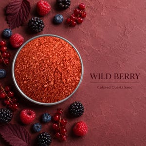 Round tin of Wild Berry colored quartz sand on a deep red textured background, surrounded by raspberries, blackberries, blueberries, red currants and dark berry leaves, with text: Wild Berry, Colored Quartz Sand.