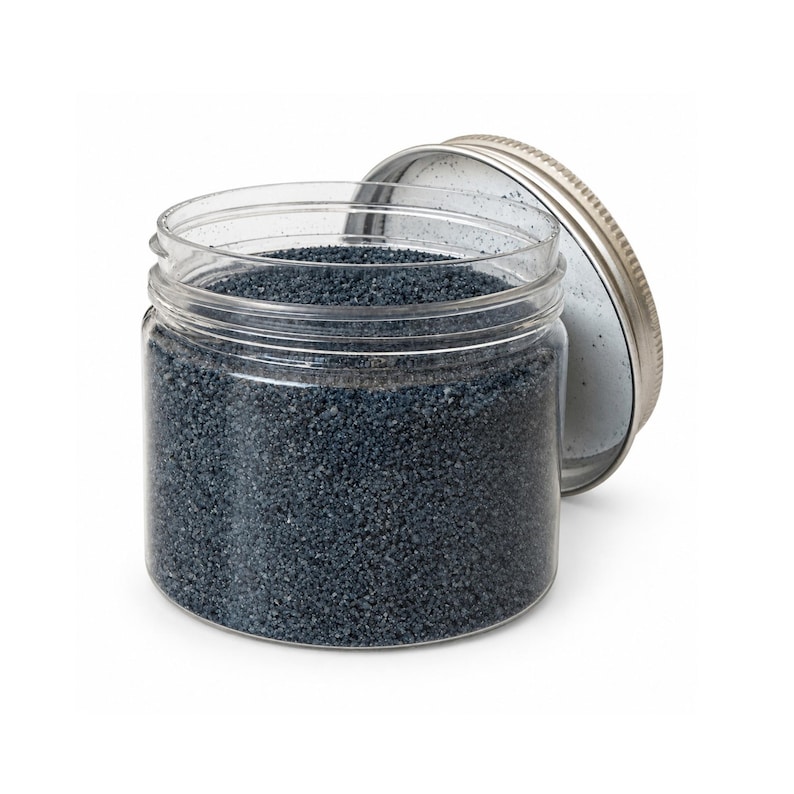 Clear plastic jar filled with Atlantic Night dark navy craft sand, silver screw-top lid leaning beside it